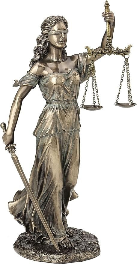 Statue of Lady Justice blindfolded, holding scales of balance and a sword, symbolizing impartial justice during Reconstruction.