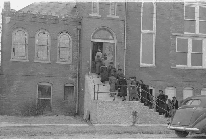 African American residents entering a public building in Mound Bayou, Mississippi, early 20th century