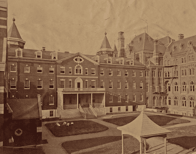 Historic 1890s photograph of Georgetown College buildings, Jesuit institution, Georgetown University history, Jesuit slave sale legacy, Washington D.C. Catholic education.